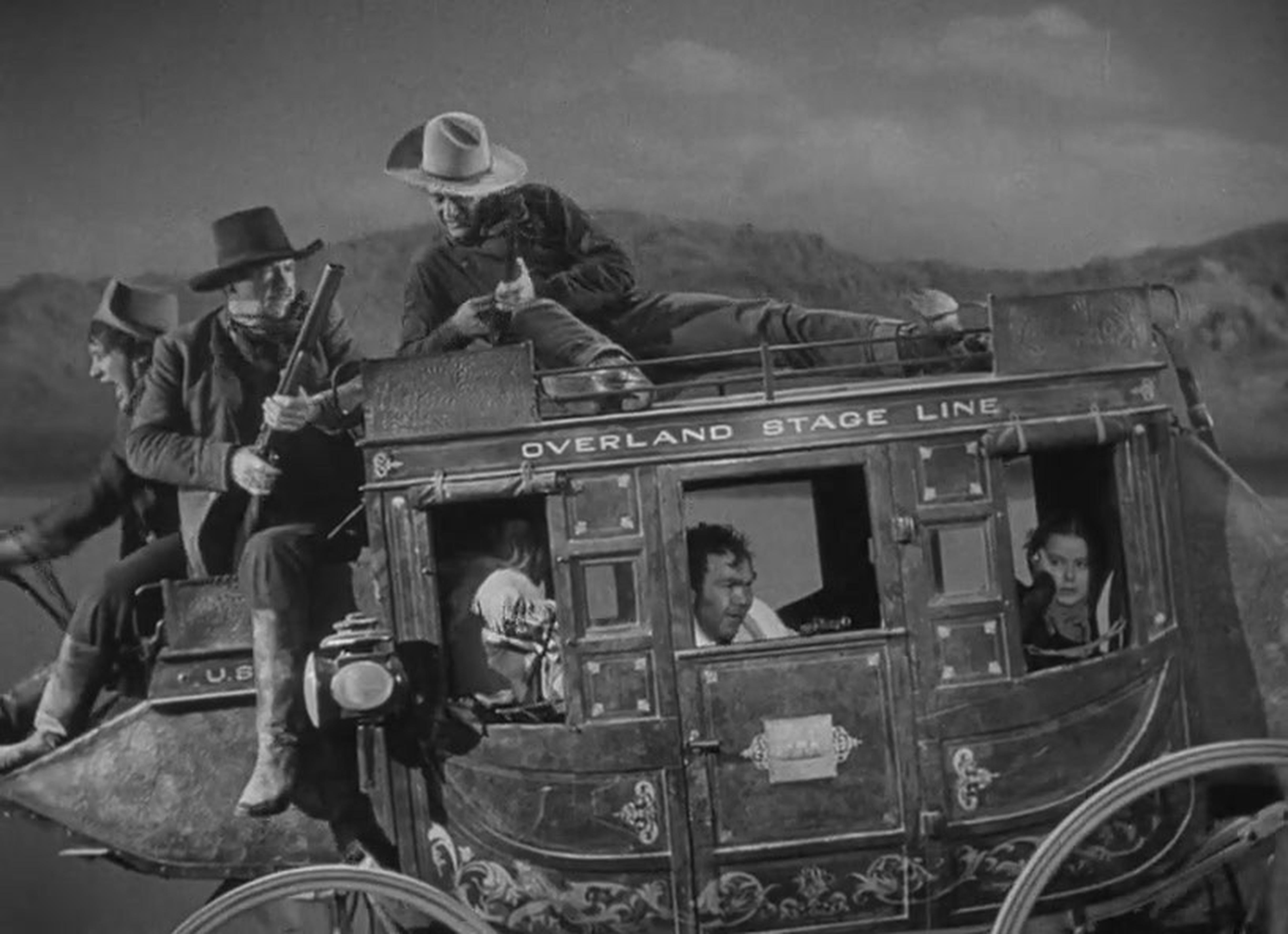 《关山飞渡》(1939) – 曾参与《宾虚》中战车交锋一幕的亚基马·坎纳特通过这部经典西部片真正确立了他作为特技演员和协调员的地位。在本片中他扮演一个阿帕奇人，从自己的马背上跳进了拉着马车的马队中，然后他背后“中枪”，跌落马背并被车轮碾过。这是一个被多部电影模仿过的特技效果，包括稍后会在本文中提及的《夺宝奇兵》，但在当时，表演这个特技极度缺少安全措施。